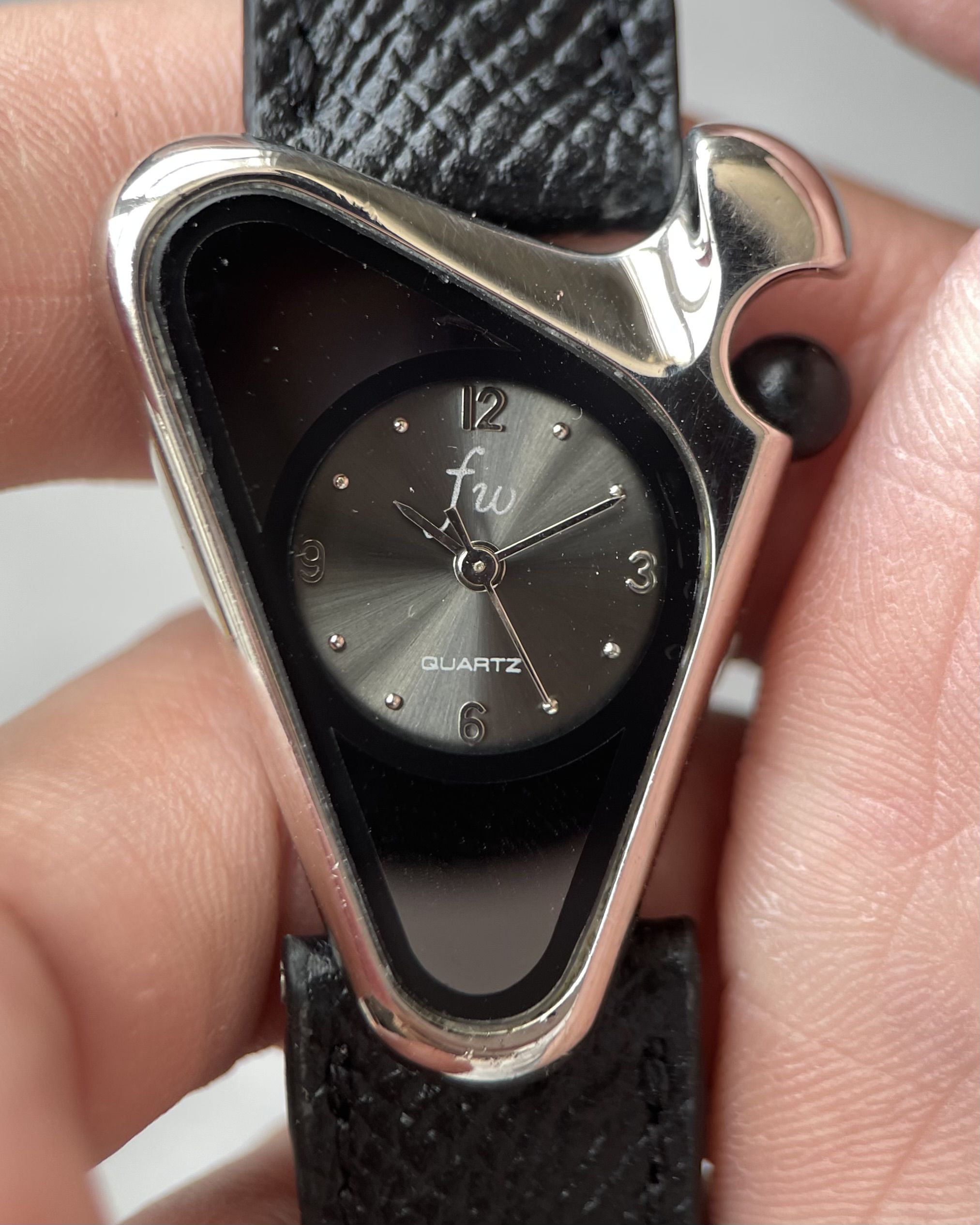 FW TRIANGULAR BLACK DIAL VINTAGE QUARTZ WATCH